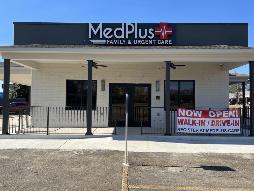 A building with a sign that says medplus family and urgent care.