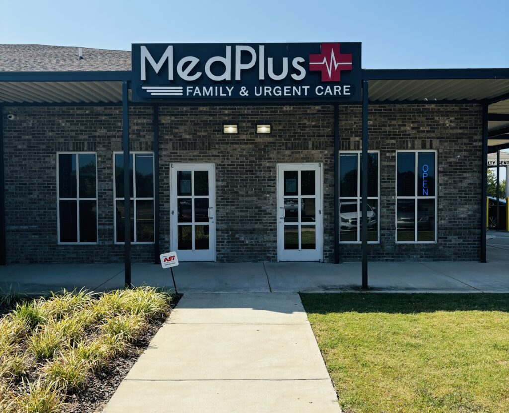 A building with a sign that says medplus family & urgent care.